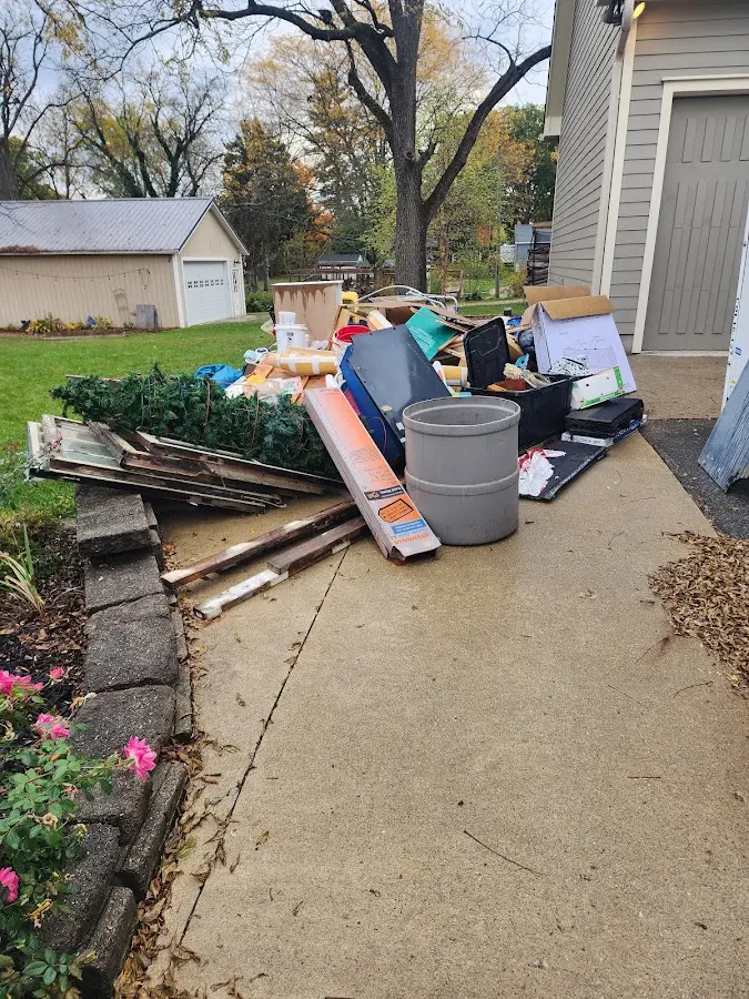 Dumpster being loaded with debris for 3 Yard Dumpster Rental in El Sobrante